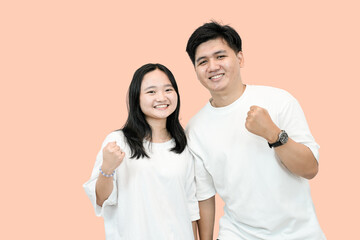 Supportive Couple: Man and Woman Making Fists in Encouragement