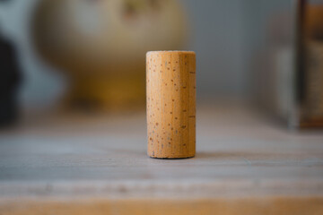 Single cork sitting on tabletop