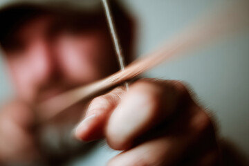 dynamic portrait of sports archer captured in motion on left side of frame