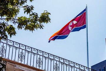 North Korean flag waving on the roof of a building at the North Korean embassy in Mexico City
