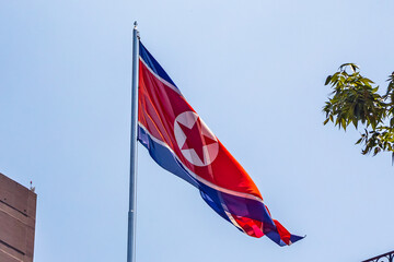 North Korean flag waving on the roof of a building at the North Korean embassy in Mexico City