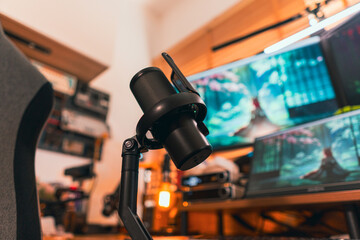 Modern podcast setup with professional microphone on boom arm in cozy home studio, featuring...