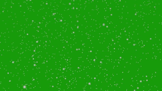 Snowfall overlay, natural snow in slow motion on green screen background. Heavy snowstorm with falling snowflakes. Looping snow flakes falling matte on green background. Isolated falling snow in 4K