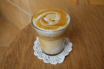 A beautifully crafted latte, featuring creamy foam art on top of rich espresso. Perfect for...