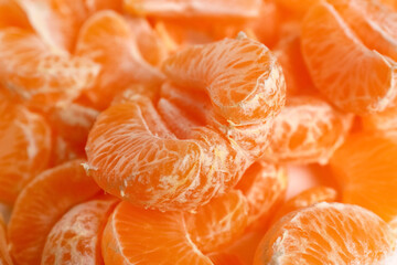 Texture of sweet peeled mandarins as background