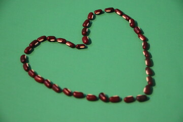 Long Bean Seeds Arranged in Heart Shape Art

Artistic Love Symbol Made from Long Bean Seeds