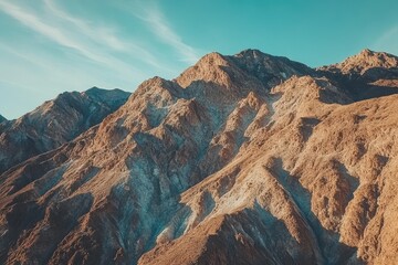 Obraz premium Aerial view captures the rugged beauty of mountain peaks in Death Valley National Park at sunset, Aerial view of mountain peaks in Death Valley