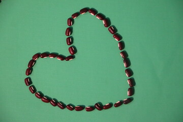 Minimalist Heart Symbol Made with Long Bean Seeds

Top View of Long Bean Seeds Arranged in Romantic Design