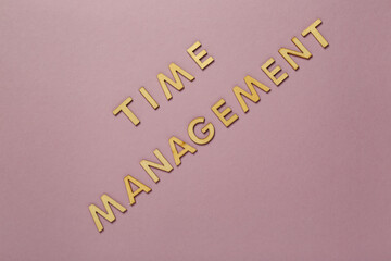 Text TIME MANAGEMENT on pink background. Top view