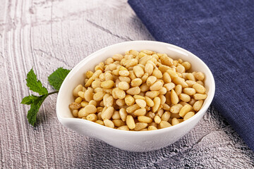 Peeled cedar nut in the bowl