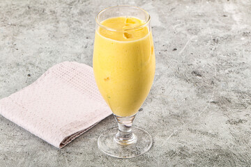 Cold sweet mango smoothie glass