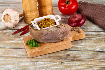 Steamed pork tongue with mustard
