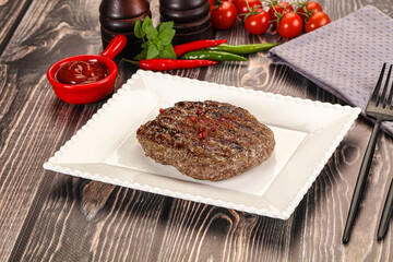 Grilled beef burger cutlet with sauce