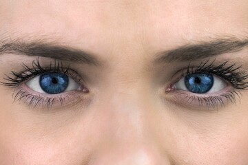 Flat design showing woman's bright blue eyes, mascara lashes, brow arches on transparent background