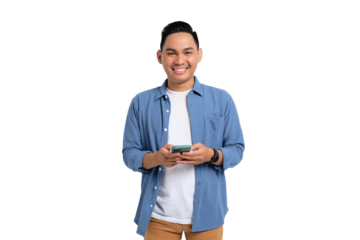 Smiling young Asian man in casual shirt using smartphone, chatting online, texting message, looking at camera isolated on transparent background