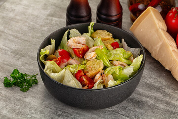 Tasty caesar salad with prawn