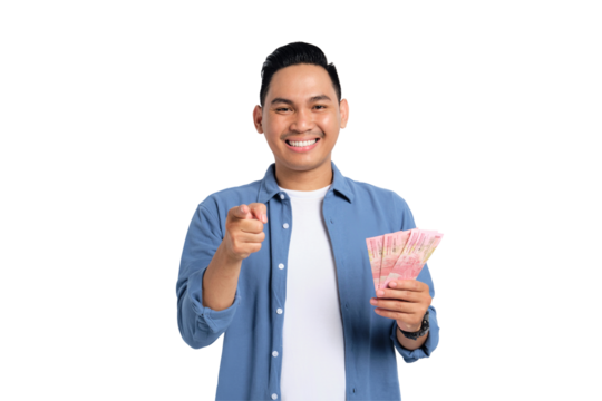 Successful financial planning. Smiling young Asian man in casual shirt holding money and pointing finger at camera isolated on transparent background