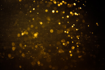 Blurred photo with golden dots visible glittering, shining brightly look and feel luxurious Suitable for use as a wallpaper
