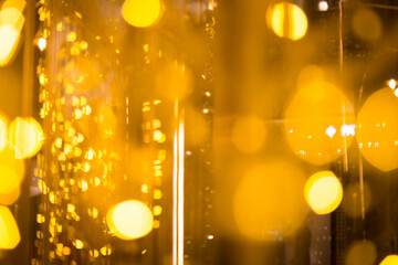 close-up blurred photo Golden decorative lights create a luxurious atmosphere at night events. Helps to take beautiful