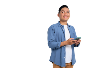 Doubtful young Asian man in casual shirt holding smartphone, looking aside at free space, thinking about something isolated on transparent background