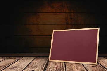 Photo sur Plexiglas Blank wooden-framed chalkboard leaning against dark plank wall and floor in flat design