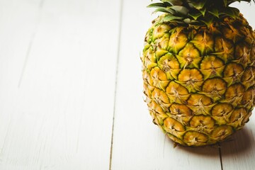 Fresh pineapple on wooden table