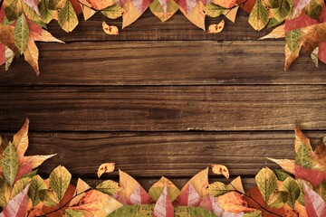 Rectangular wooden board is being framed by autumn leaves in flat rustic design, copy space