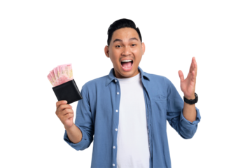Excited young Asian man in casual shirt holding wallet full of cash, celebrating financial success isolated on transparent background