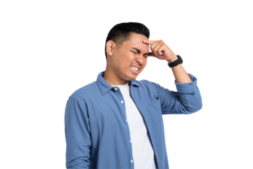 Tired young Asian man in casual shirt suffering from headache or migraine, massaging his temples with closed eyes isolated on transparent background