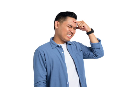 Tired young Asian man in casual shirt suffering from headache or migraine, massaging his temples with closed eyes isolated on transparent background