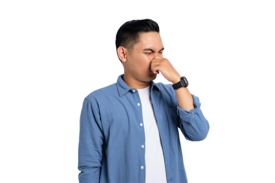 Young Asian man in casual shirt holding breath with finger on nose, smelling something stinky and disgusting isolated on transparent background