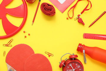 Frame made of frisbee, ping pong rackets, alarm clock, whistle, boxing bandage and different...