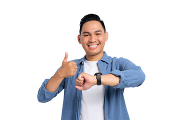 Smiling young Asian man in casual shirt wearing watch and showing thumbs up isolated on transparent...