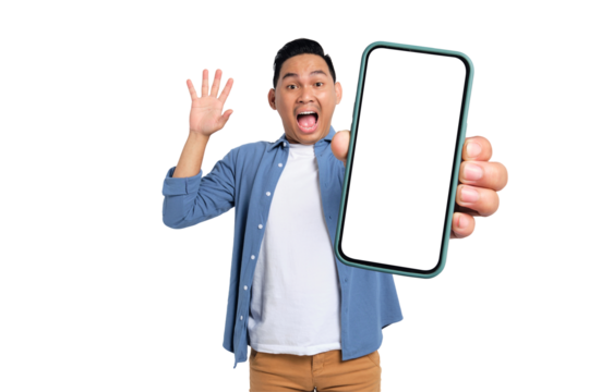Shocked young Asian man in casual shirt holding smartphone with blank screen, raising his hand with amazed expression isolated on transparent background - Powered by Adobe