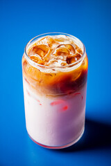 Enjoy a delightful layered iced drink filled with flavors and colors, perfect for a sunny day