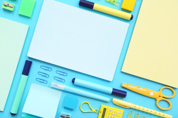 Composition with different stationery on blue background, closeup