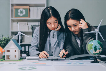 Business team people planning and discussing on recycle reduce reuse policy symbol in office meeting room.