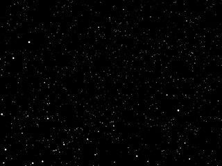 A black background is filled with numerous white dots of varying sizes.