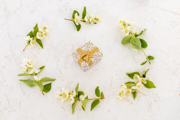 Gift box with flowers on the white background.