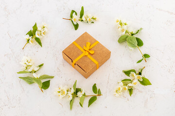 Gift box with flowers on the white background.