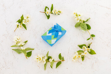 Gift box with flowers on the white background.
