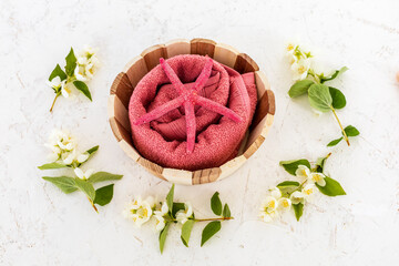 Spa products for facial and body care with soft terry towel.