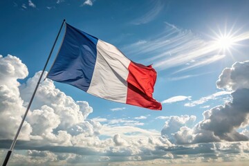 The french tricolore flag waves proudly under a bright sunny sky