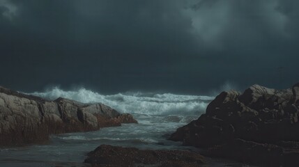 Stormy waves crashing against rugged coastal rocks.