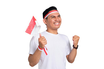 Excited young Asian man celebrate Indonesian independence day on 17 August by holding the...