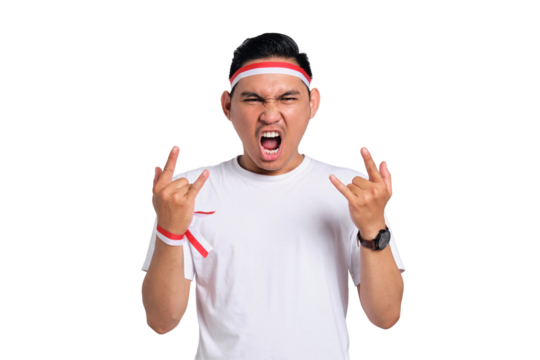 Excited young Asian man celebrate Indonesian independence day on 17 August and showing rock metal signs isolated on transparent background