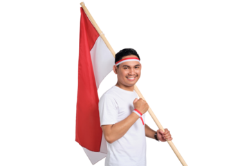 Excited young Asian man celebrate Indonesian independence day on 17 August by holding the Indonesian flag isolated on transparent background