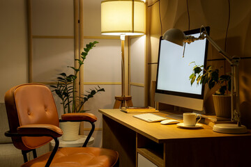 Interior of dark office with workplace, folding screen and glowing lamps