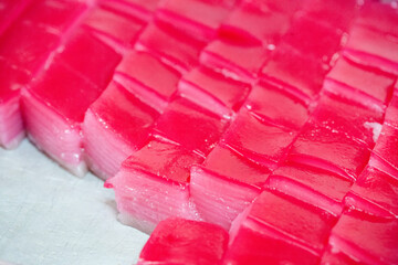 Colorful Khanom Chan arranged in a traditional setting, highlighting the culture, textures and...