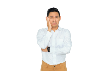 Portrait of bored young Asian man in casual clothes holding his cheek and feeling frustrated, having problems isolated on transparent background